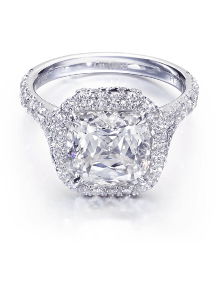 Cushion cut diamond engagement ring with halo and classic round diamond setting